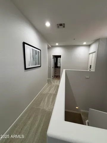 a view of a hallway with a large window