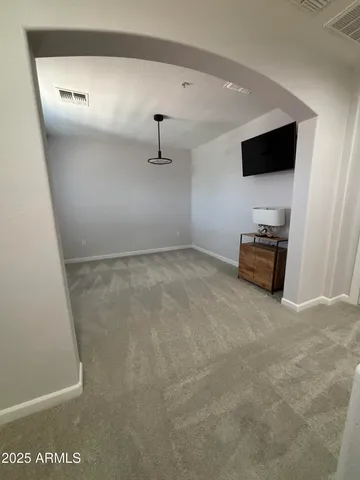 a view of empty room with flat screen tv