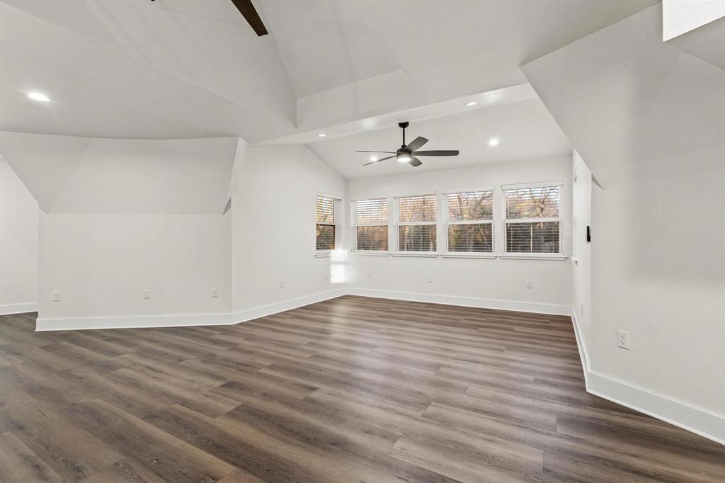 1325 Reynolds Road Whitewright, TX 75491 - Photo 9 of 39 a view of an empty room with wooden floor and a window