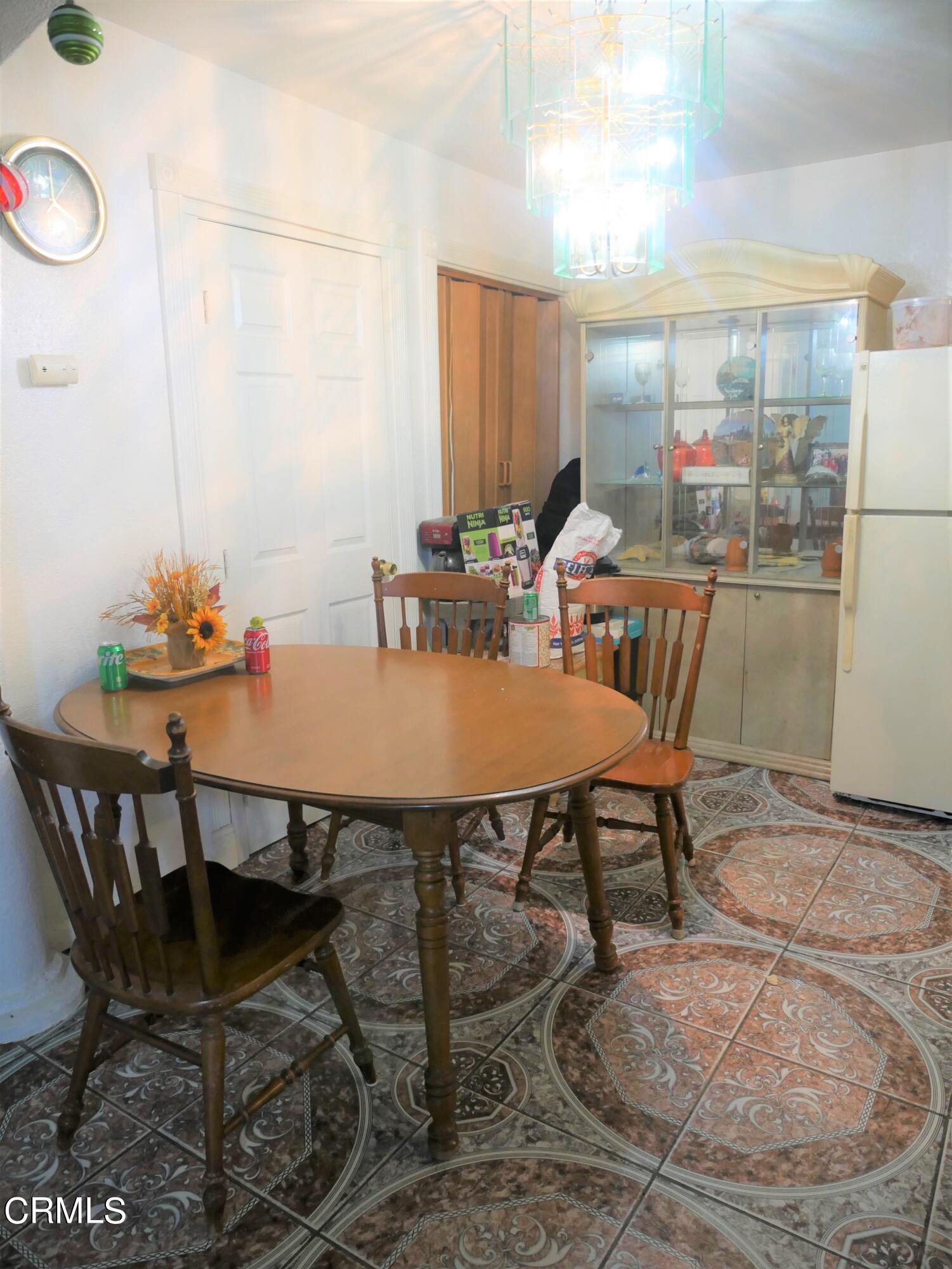 640 Tamarac Street Oxnard, CA 93033 - Photo 12 of 54 a view of a dining room with furniture window and outside view