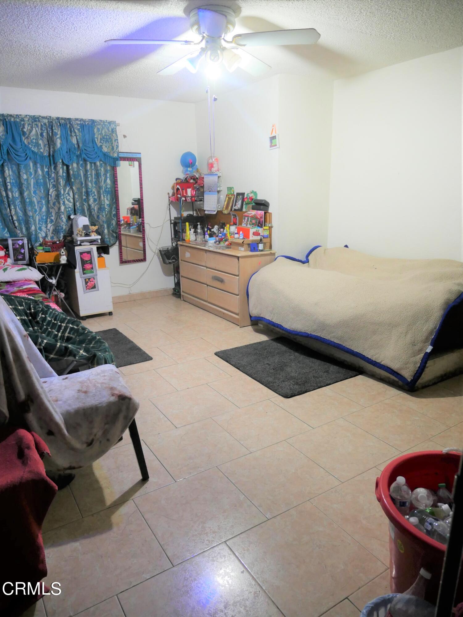 640 Tamarac Street Oxnard, CA 93033 - Photo 15 of 54 a bedroom with furniture and a couch