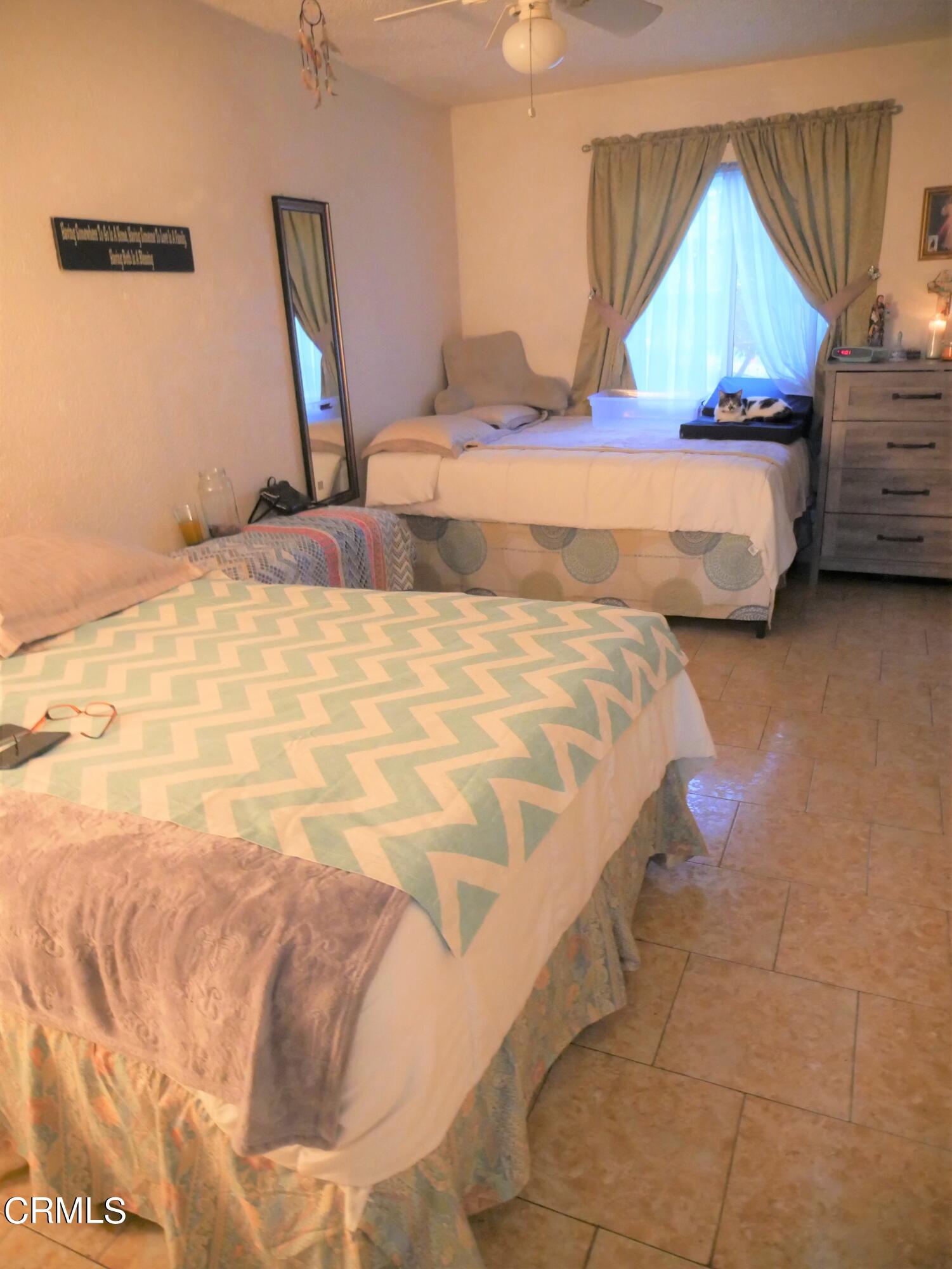 640 Tamarac Street Oxnard, CA 93033 - Photo 19 of 54 a bedroom with bed and window