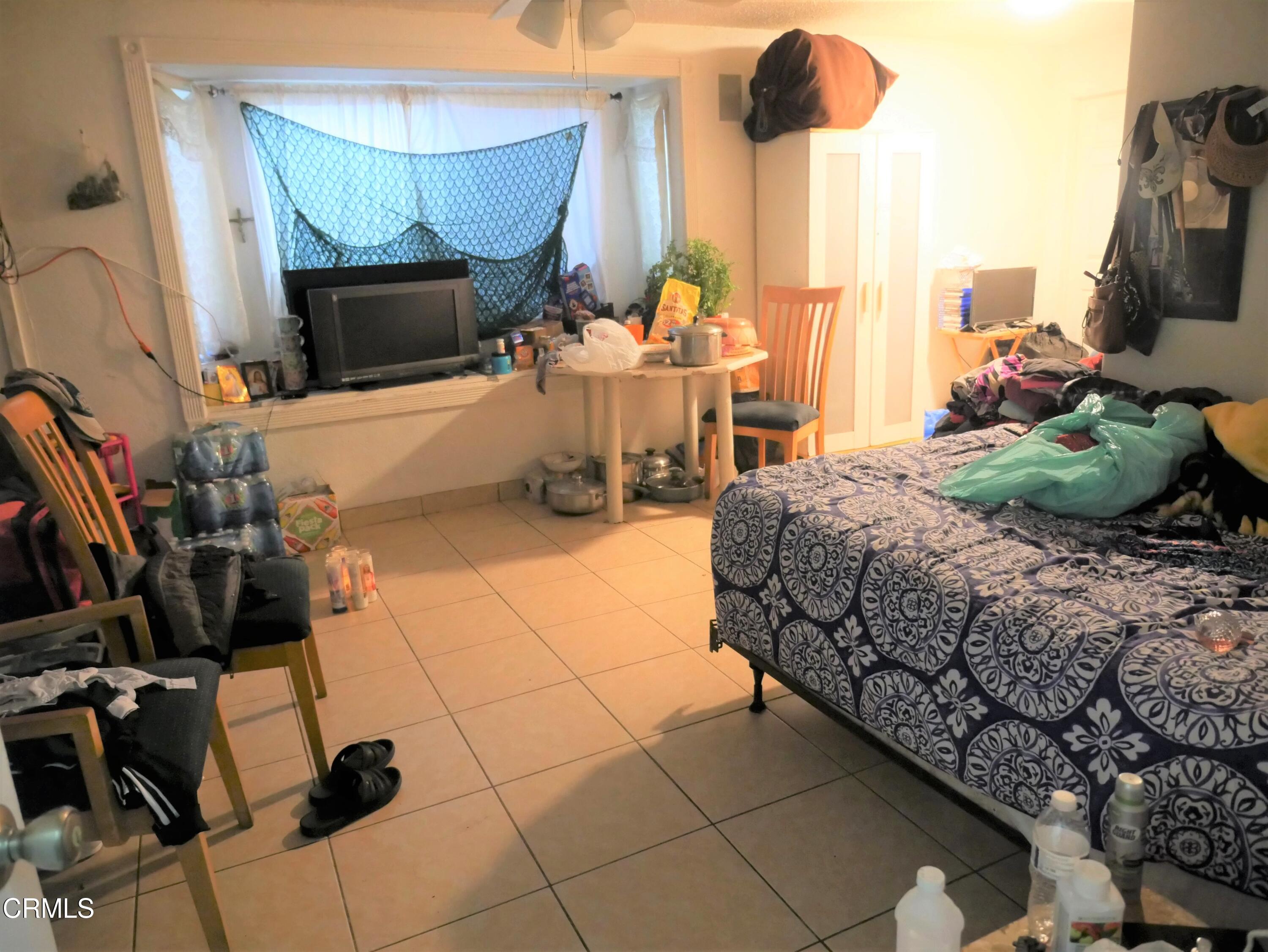 640 Tamarac Street Oxnard, CA 93033 - Photo 21 of 54 a living room with furniture a flat screen tv and a fireplace