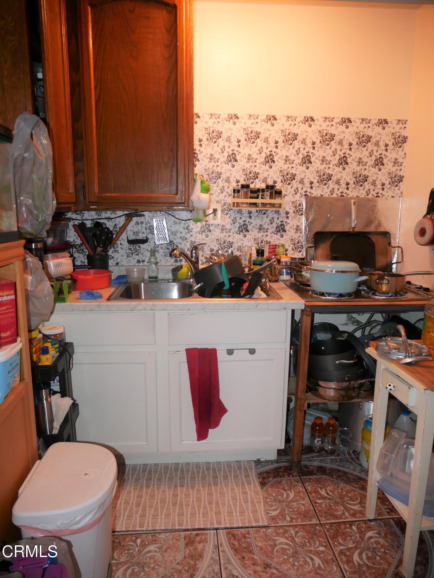 640 Tamarac Street Oxnard, CA 93033 - Photo 31 of 54 a bathroom with a toilet a sink and a window