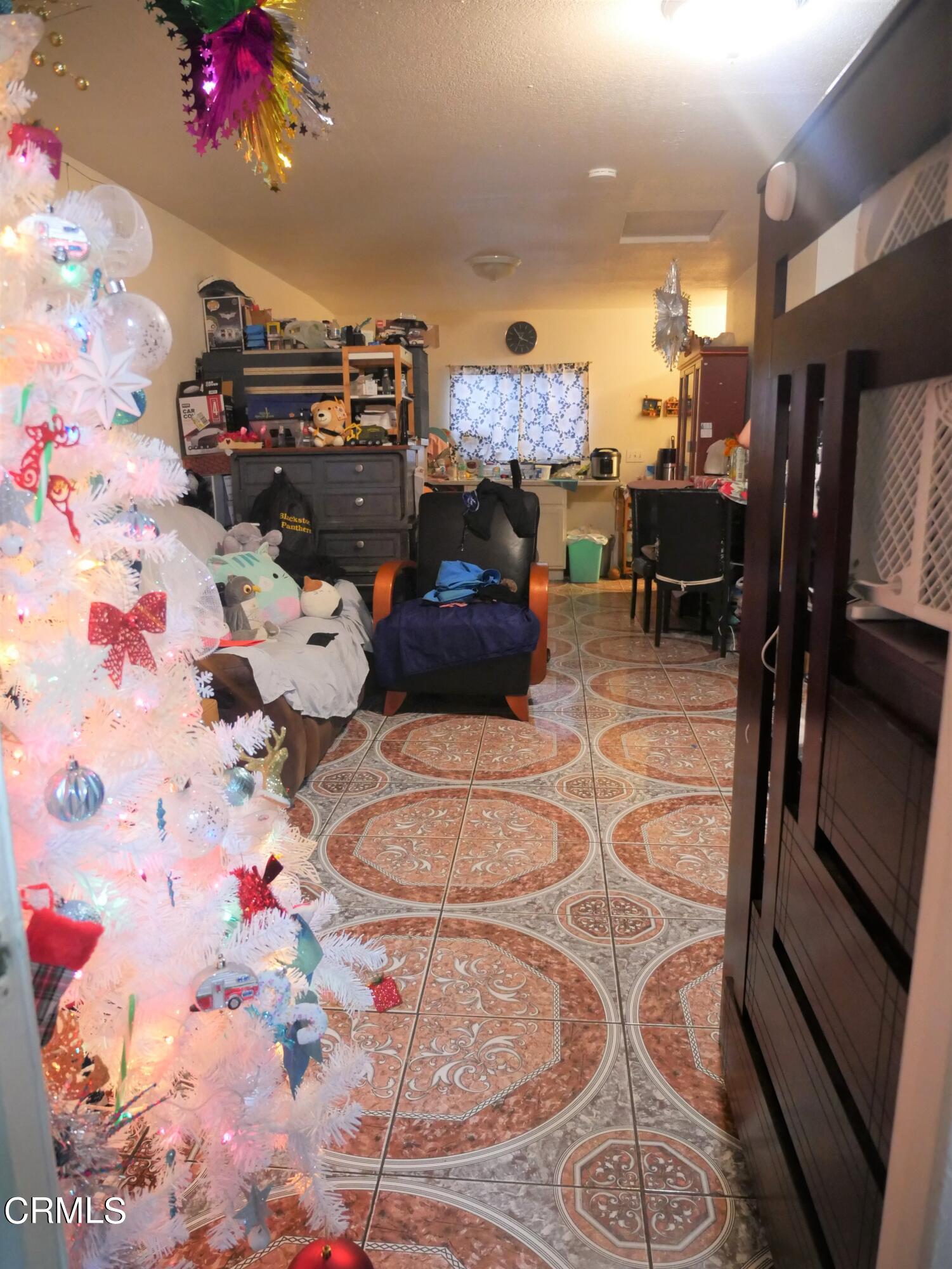 640 Tamarac Street Oxnard, CA 93033 - Photo 37 of 54 a living room with furniture and a flat screen tv