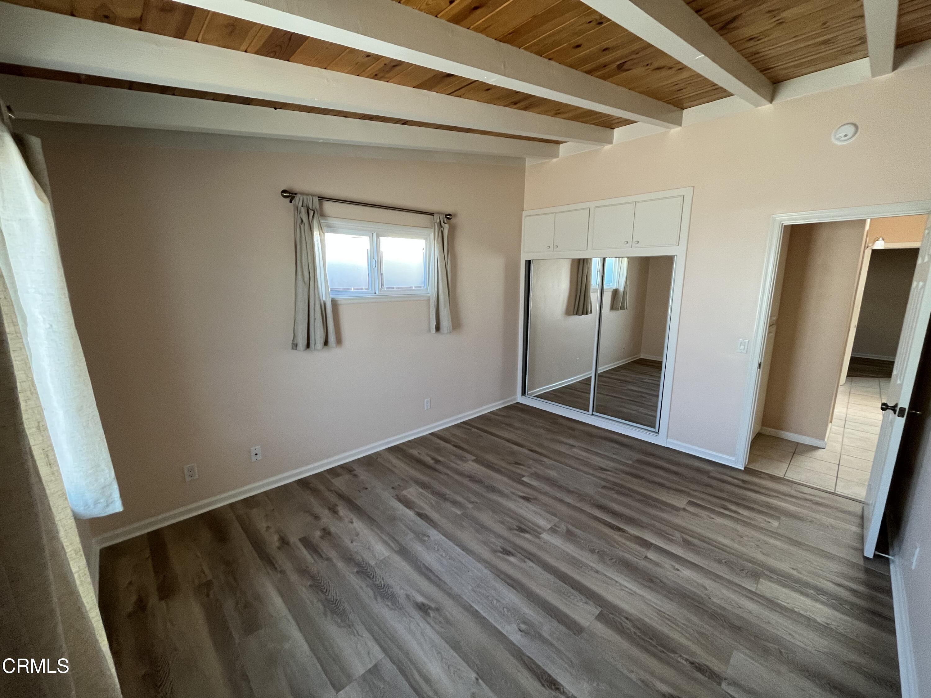 304 Cahuenga Drive Oxnard, CA 93035 - Photo 8 of 9 a view of empty room with wooden floor