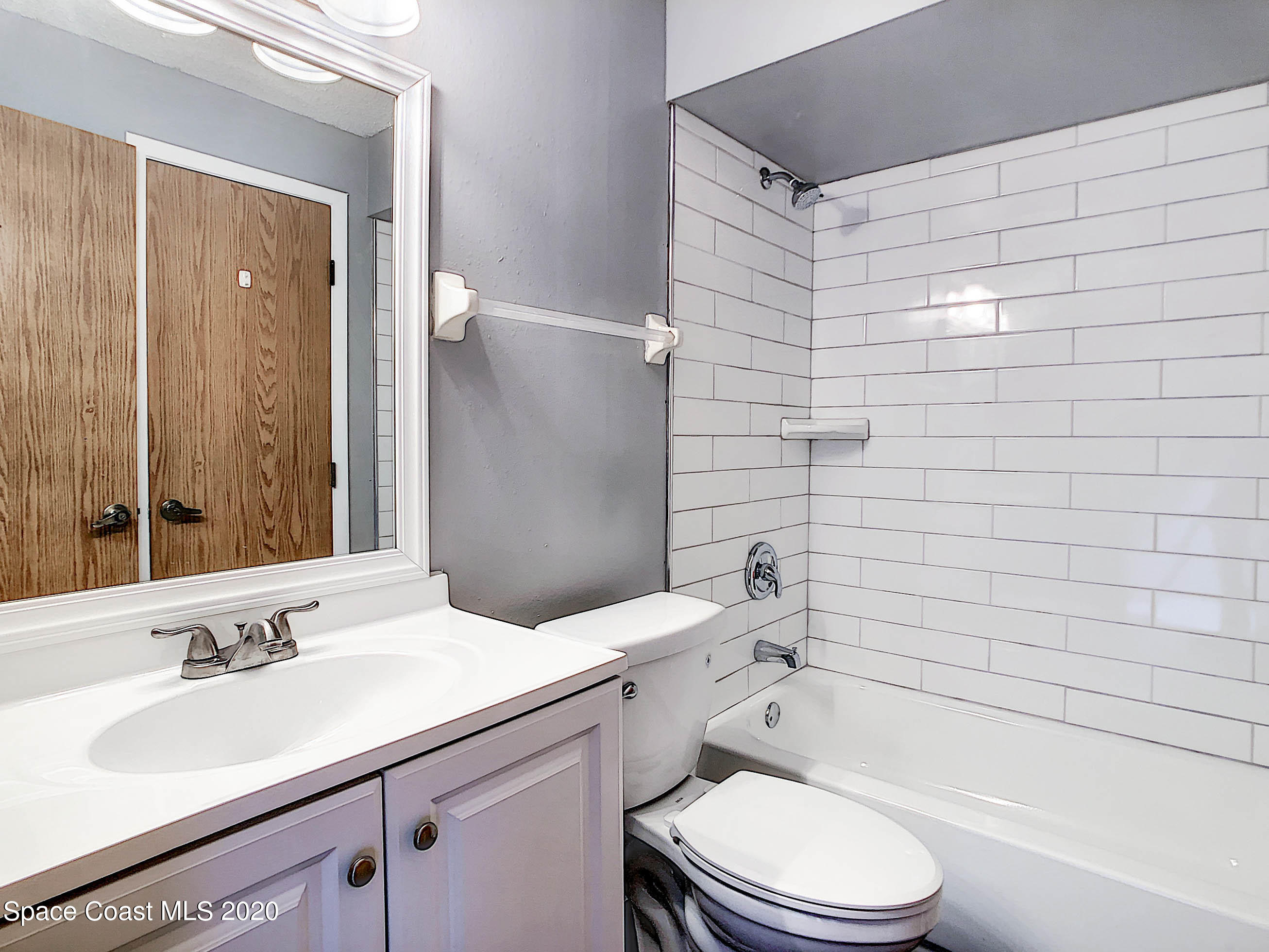 1882 Murrell Road, Unit 44 Rockledge, FL 32955 - Photo 13 of 27 a bathroom with a sink toilet and shower