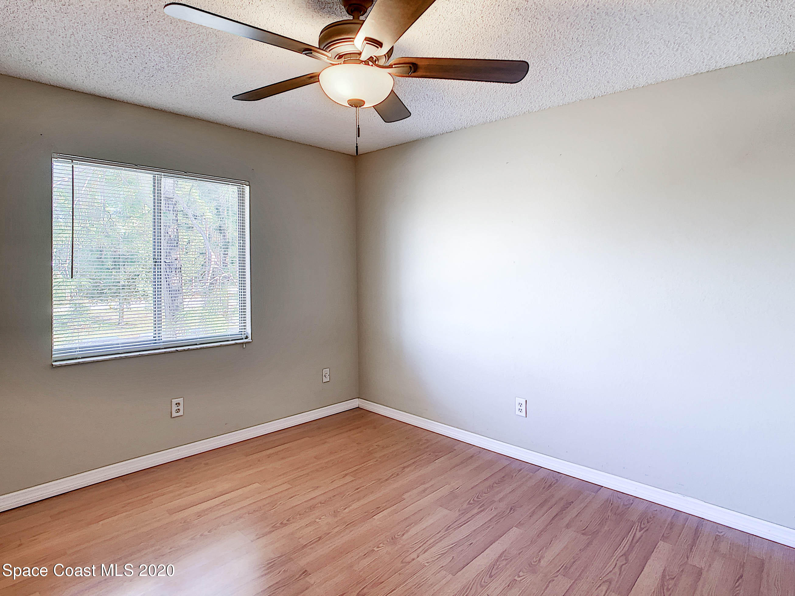 1882 Murrell Road, Unit 44 Rockledge, FL 32955 - Photo 15 of 27 an empty room with a window and a fan
