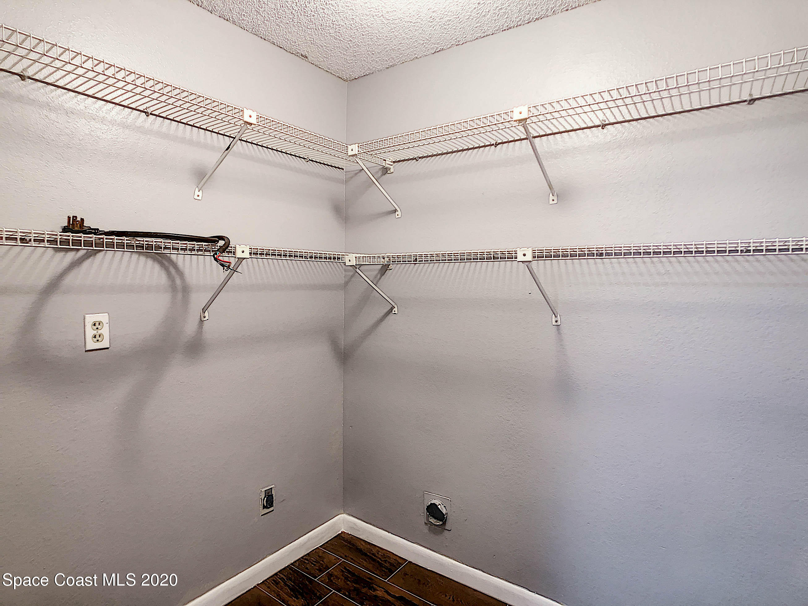 1882 Murrell Road, Unit 44 Rockledge, FL 32955 - Photo 18 of 27 a view of a room with racks on the wall