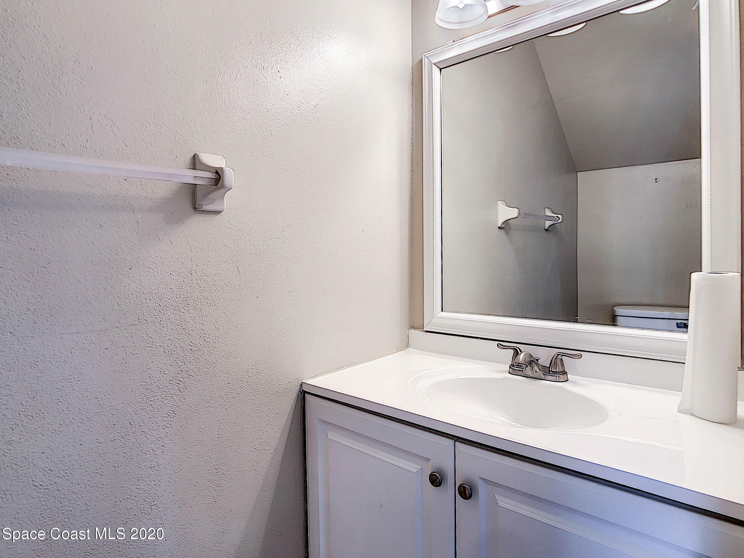 1882 Murrell Road, Unit 44 Rockledge, FL 32955 - Photo 19 of 27 a bathroom with a sink and a mirror