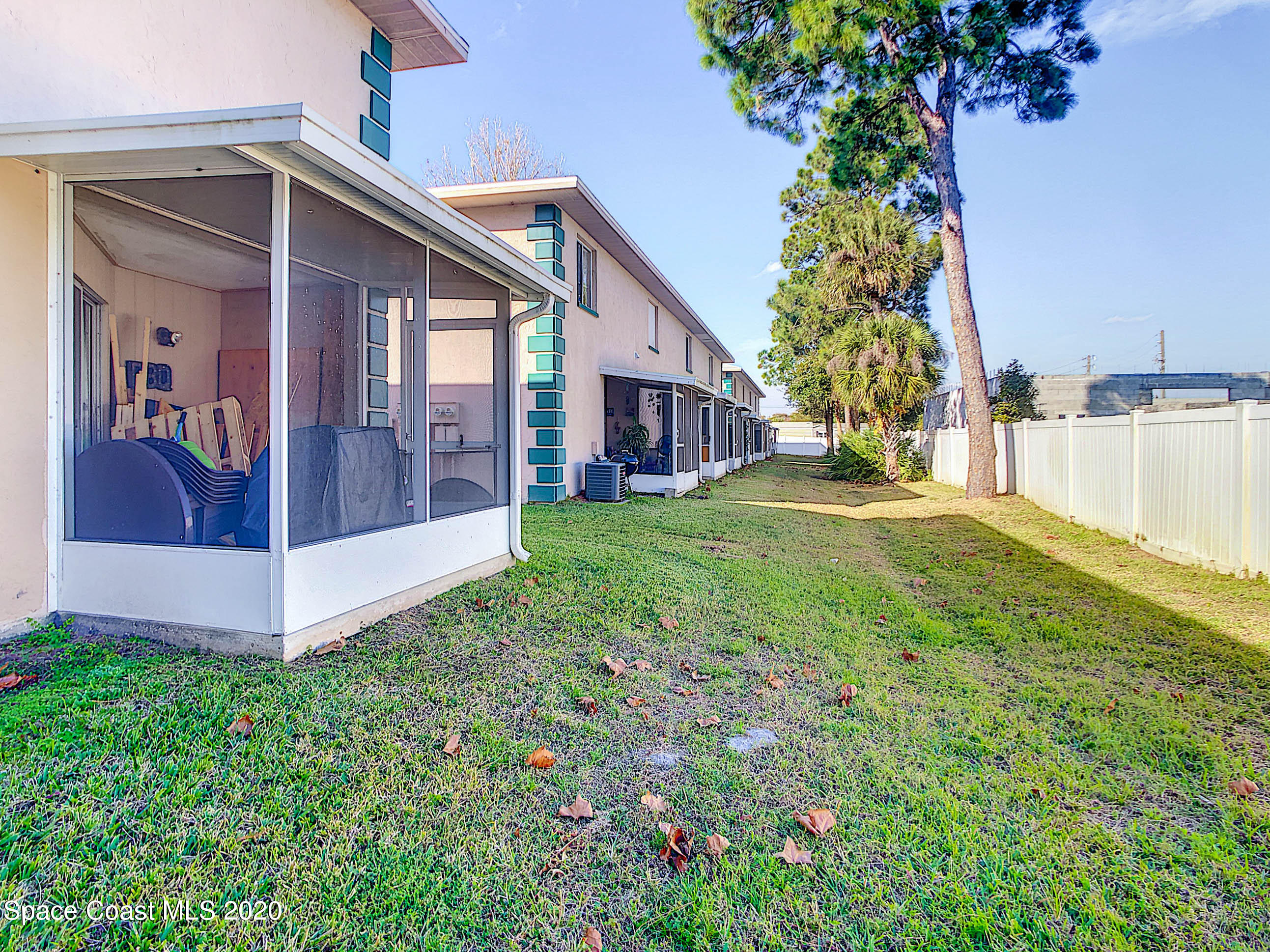 1882 Murrell Road, Unit 44 Rockledge, FL 32955 - Photo 21 of 27 a view of a house with a yard and potted plants