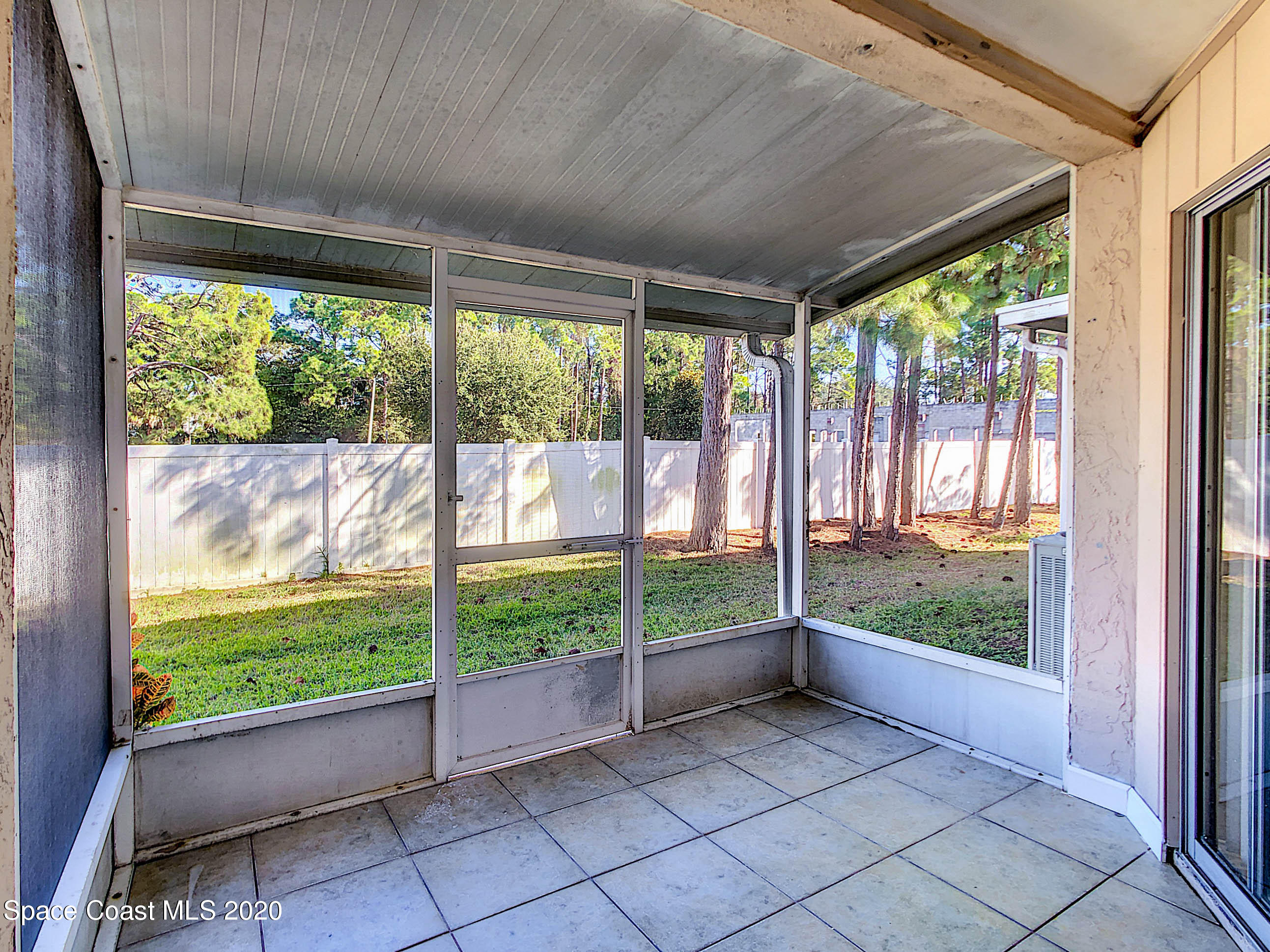 1882 Murrell Road, Unit 44 Rockledge, FL 32955 - Photo 22 of 27 a view of an empty room with wooden floor and a porch