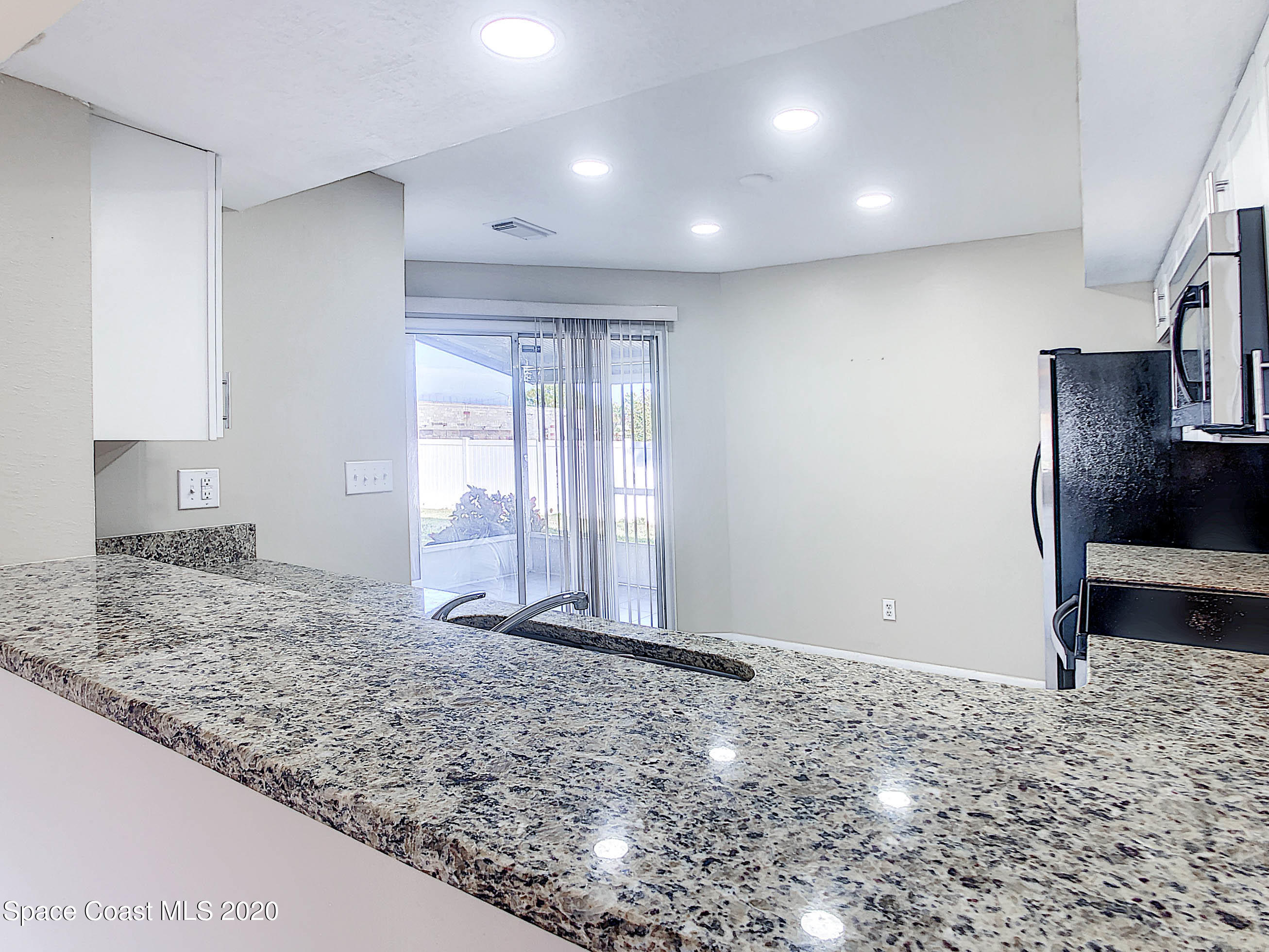 1882 Murrell Road, Unit 44 Rockledge, FL 32955 - Photo 7 of 27 a view of a livingroom with wooden floor