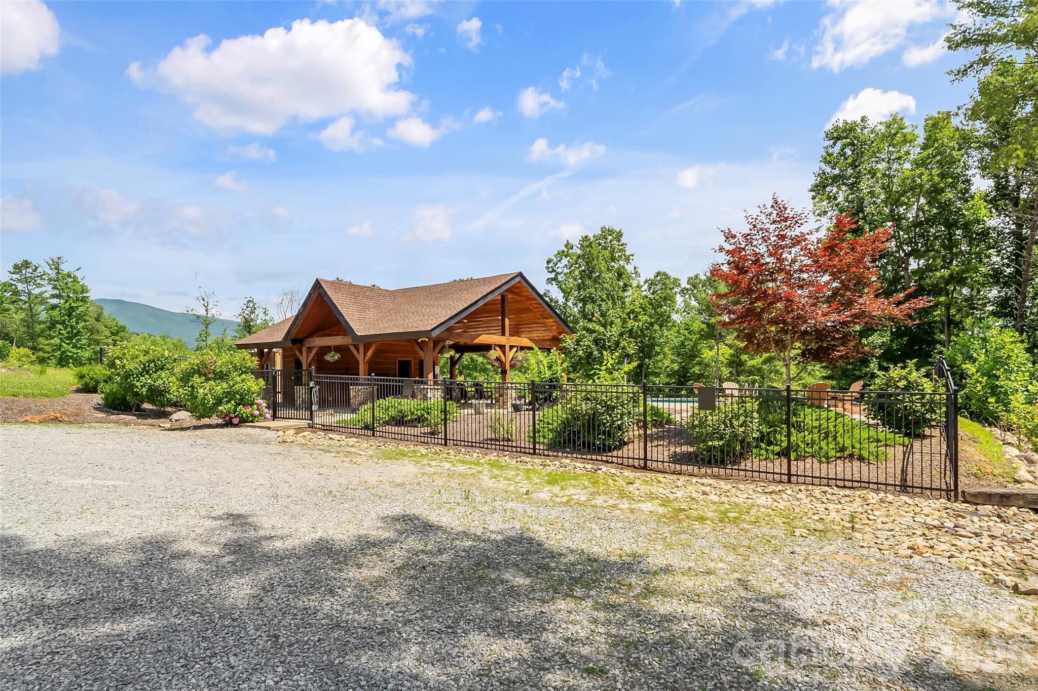 154 West Point Drive Nebo, NC 28761 - Photo 17 of 21 a front view of a house with a yard and trees