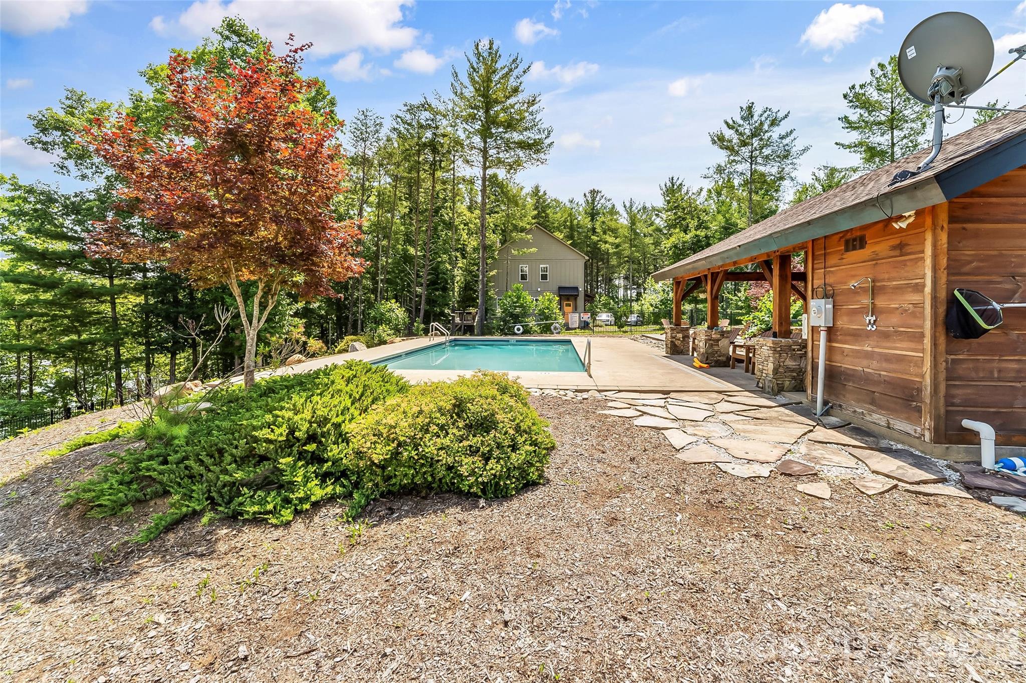 154 West Point Drive Nebo, NC 28761 - Photo 18 of 21 a view of a backyard house with large trees