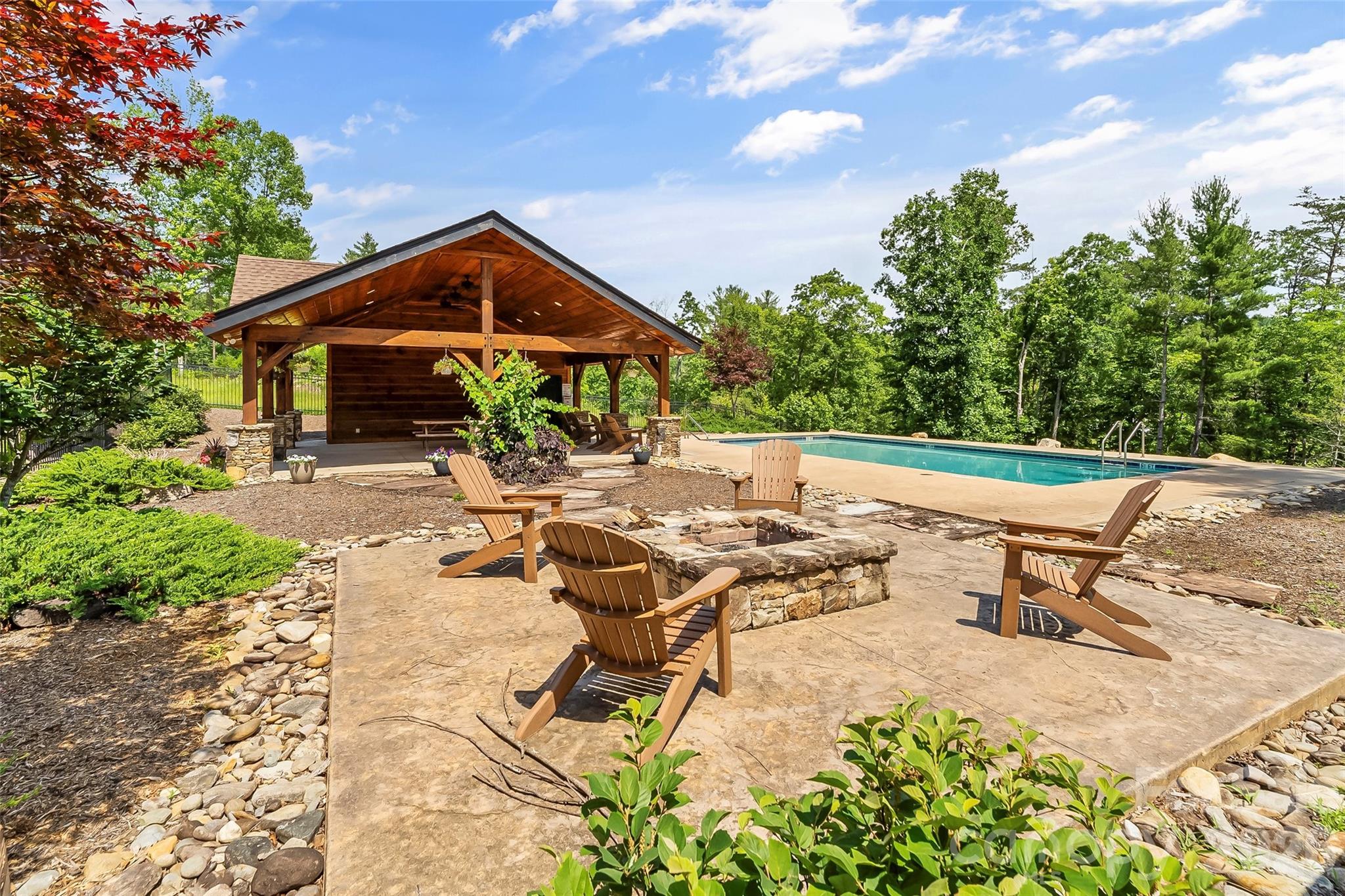 154 West Point Drive Nebo, NC 28761 - Photo 19 of 21 a view of a patio with a table and chairs under an umbrella