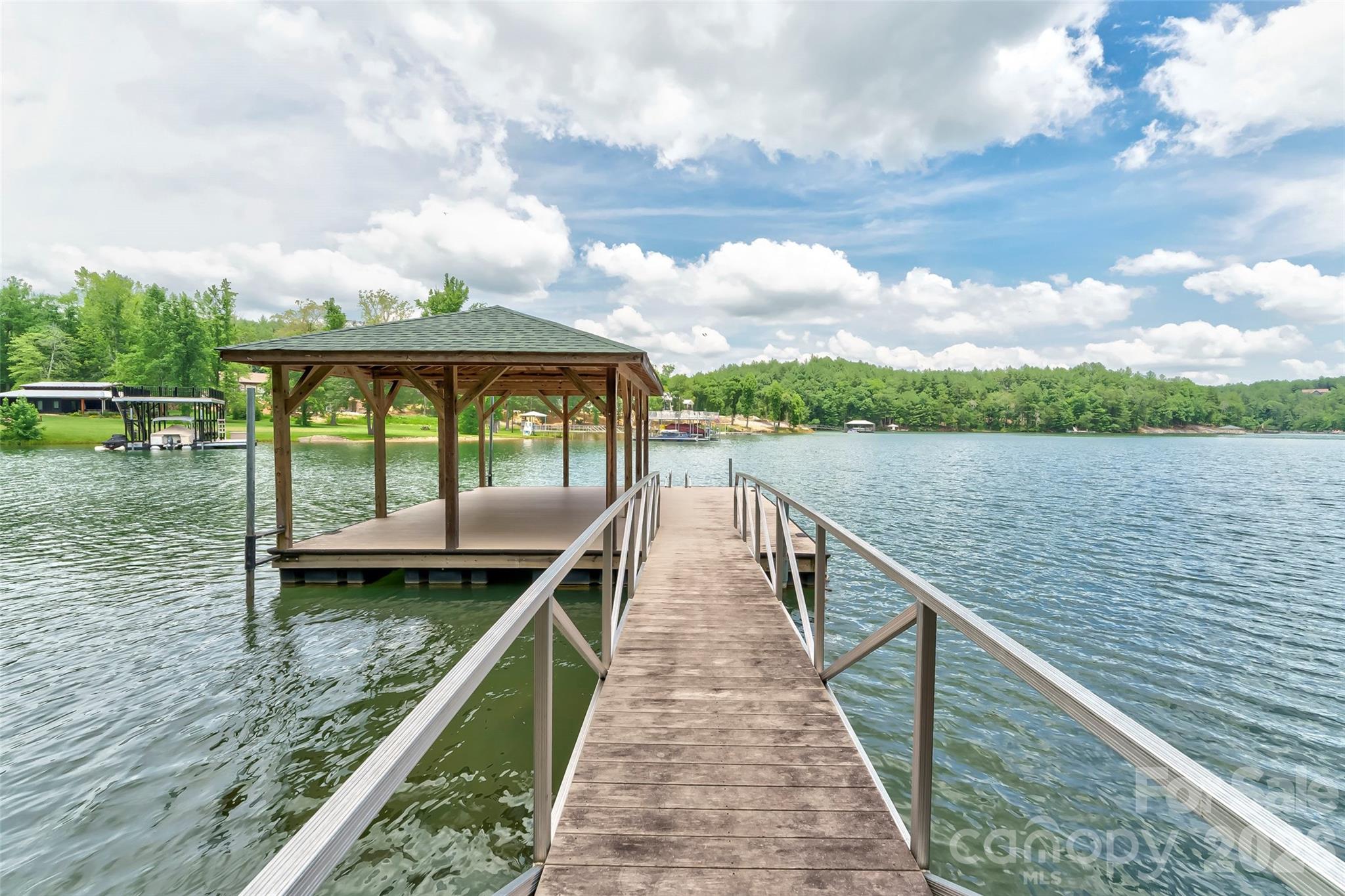 154 West Point Drive Nebo, NC 28761 - Photo 20 of 21 a view of a wooden deck and lake