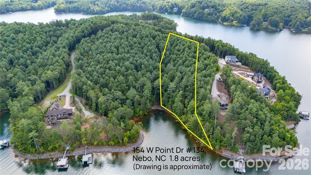 154 West Point Drive Nebo, NC 28761 - Photo 8 of 21 an aerial view of a house with a yard and lake view