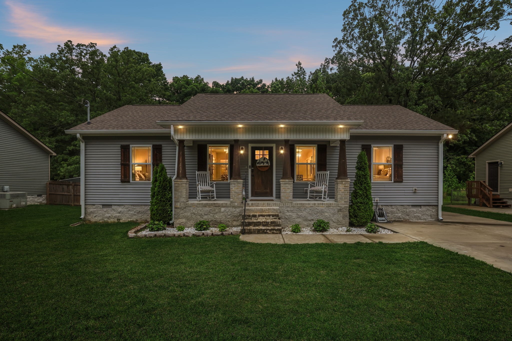1546 South Spring Street Manchester, TN 37355 - Photo 2 of 53 a front view of a house with a garden