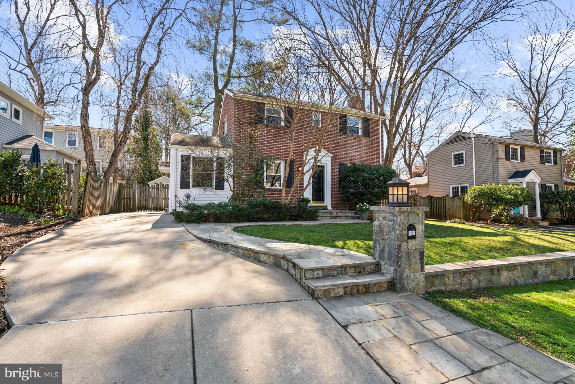 5305 Wakefield Road Bethesda, MD 20816 - Photo 3 of 87 a front view of a house with yard and green space