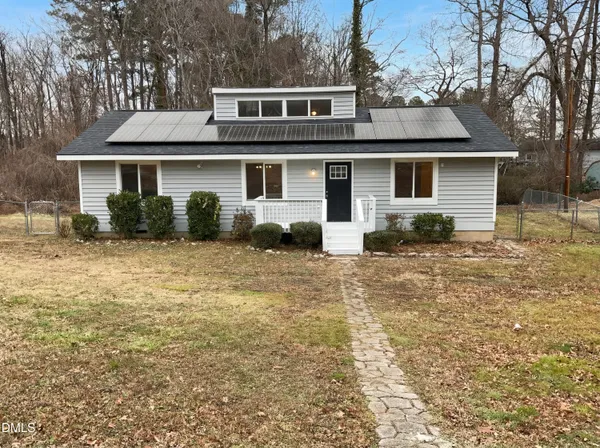 a front view of a house with yard