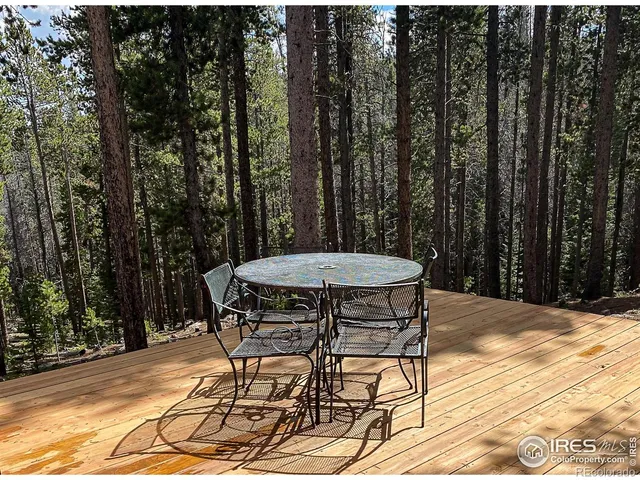a view of a table and chairs in the patio