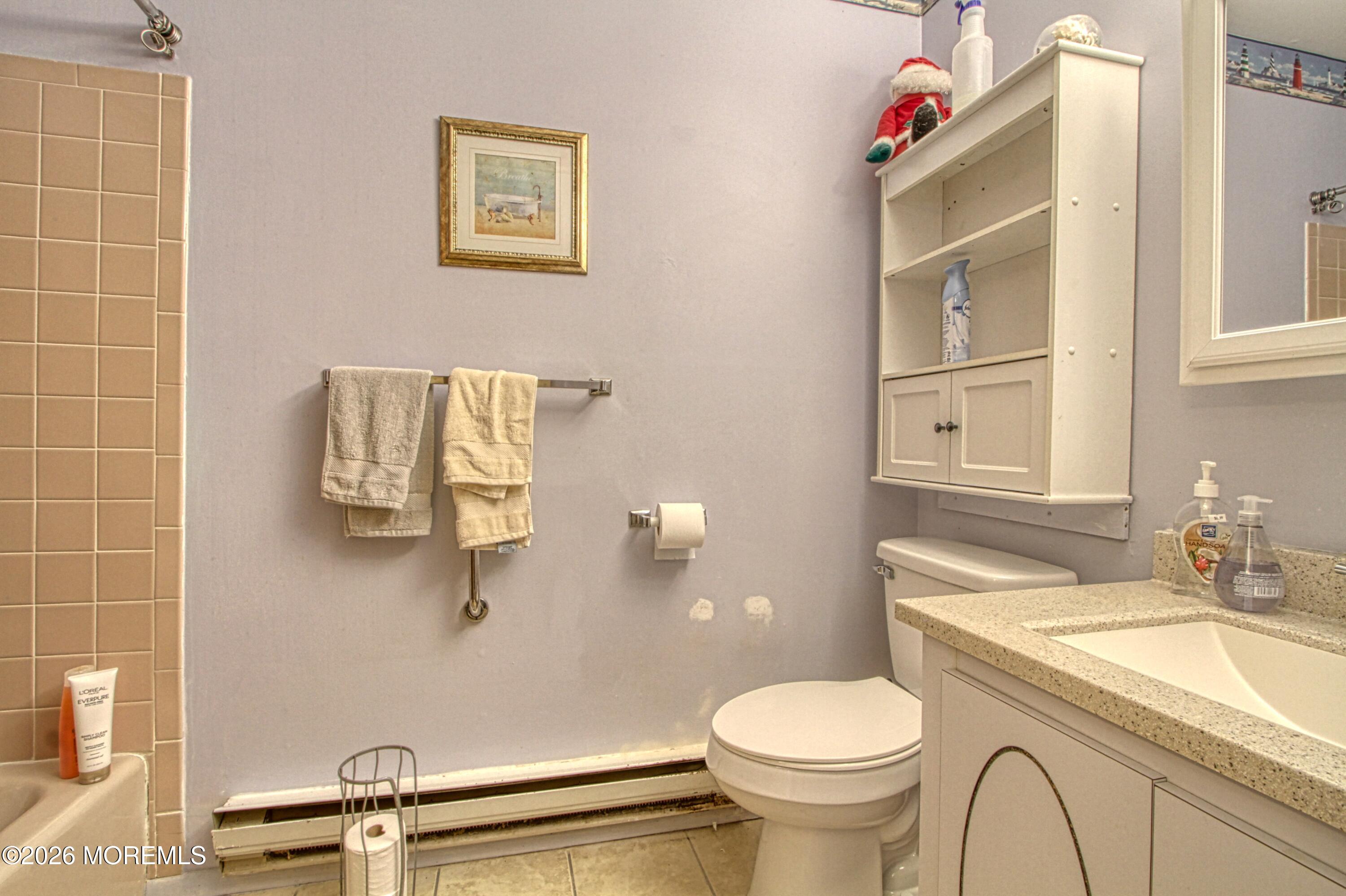 8 Lexington Drive, Unit B Whiting, NJ 08759 - Photo 9 of 11 a bathroom with a sink toilet and a mirror