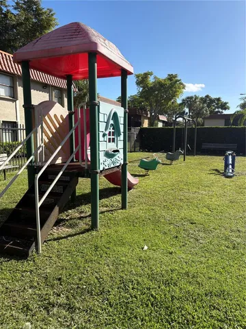a view of swimming pool with a yard