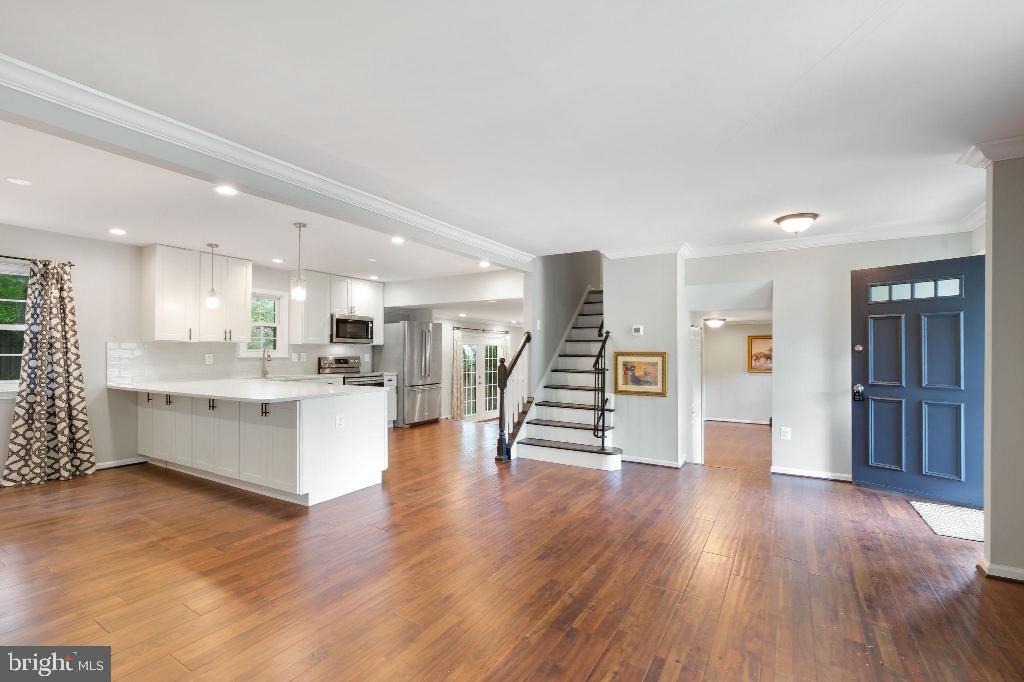 5 Winesap Court Gaithersburg, MD 20878 - Photo 12 of 44 a view of an empty room and kitchen with wooden floor