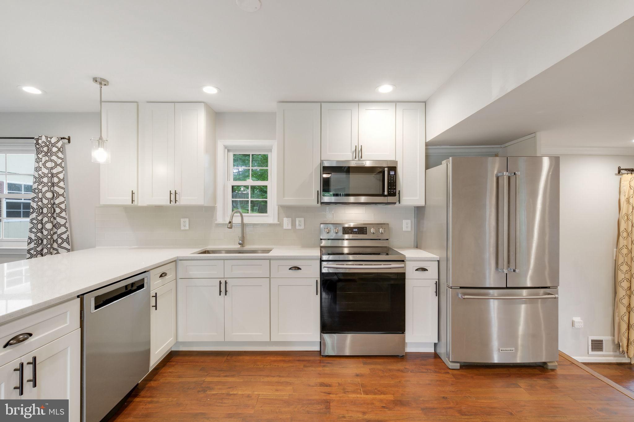 5 Winesap Court Gaithersburg, MD 20878 - Photo 16 of 44 a kitchen with stainless steel appliances granite countertop a refrigerator sink and stove