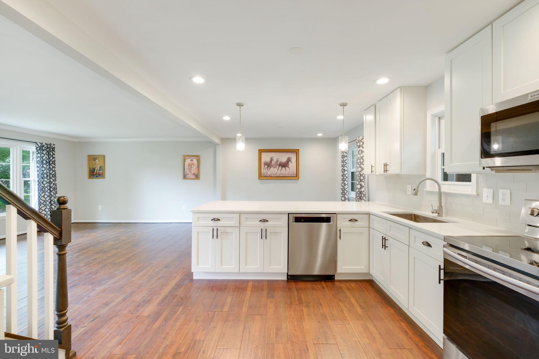 5 Winesap Court Gaithersburg, MD 20878 - Photo 17 of 44 a large kitchen with stainless steel appliances granite countertop a sink and cabinets
