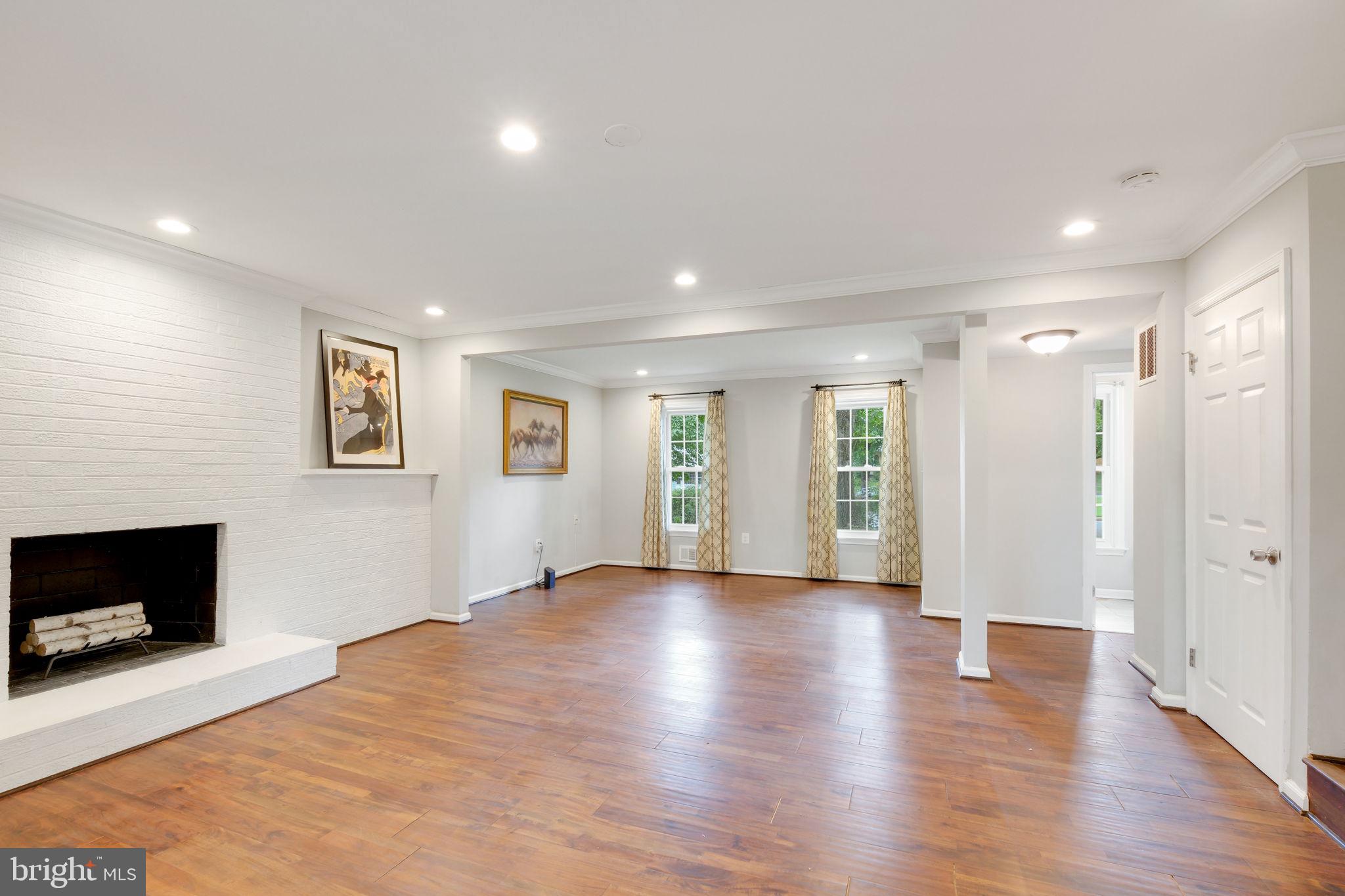 5 Winesap Court Gaithersburg, MD 20878 - Photo 19 of 44 a view of an empty room with wooden floor and a fireplace