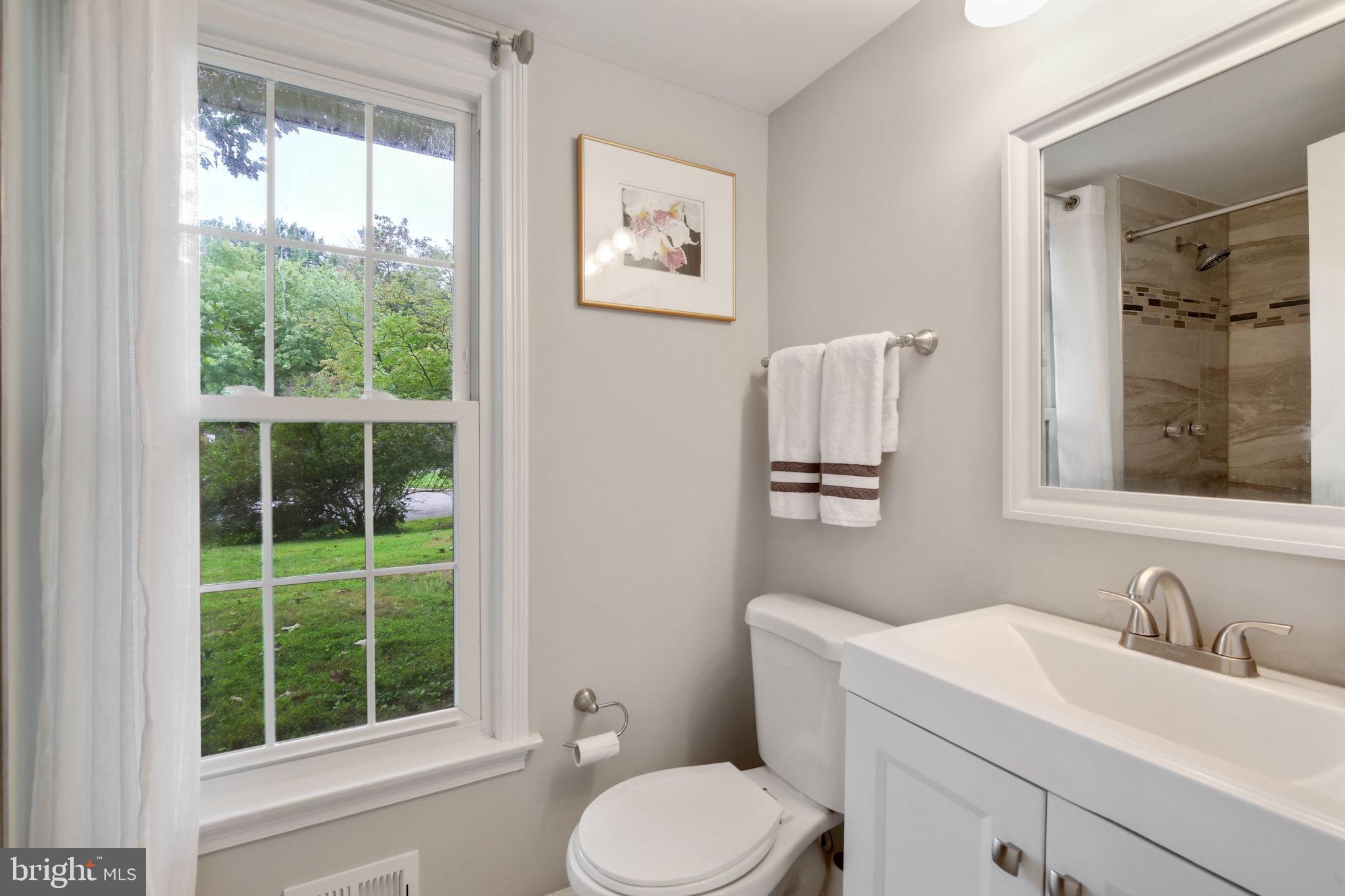 5 Winesap Court Gaithersburg, MD 20878 - Photo 23 of 44 a bathroom with a granite countertop sink toilet and mirror