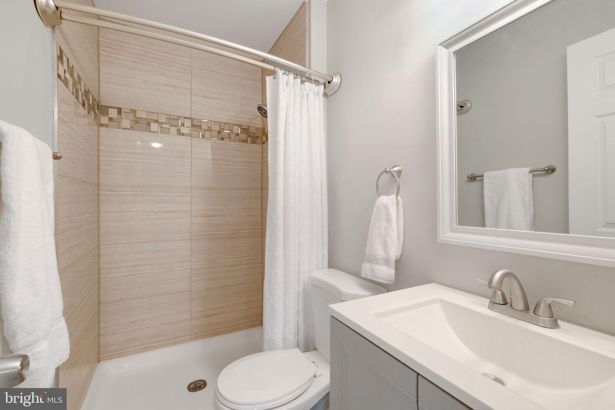 5 Winesap Court Gaithersburg, MD 20878 - Photo 26 of 44 a bathroom with a sink toilet and shower