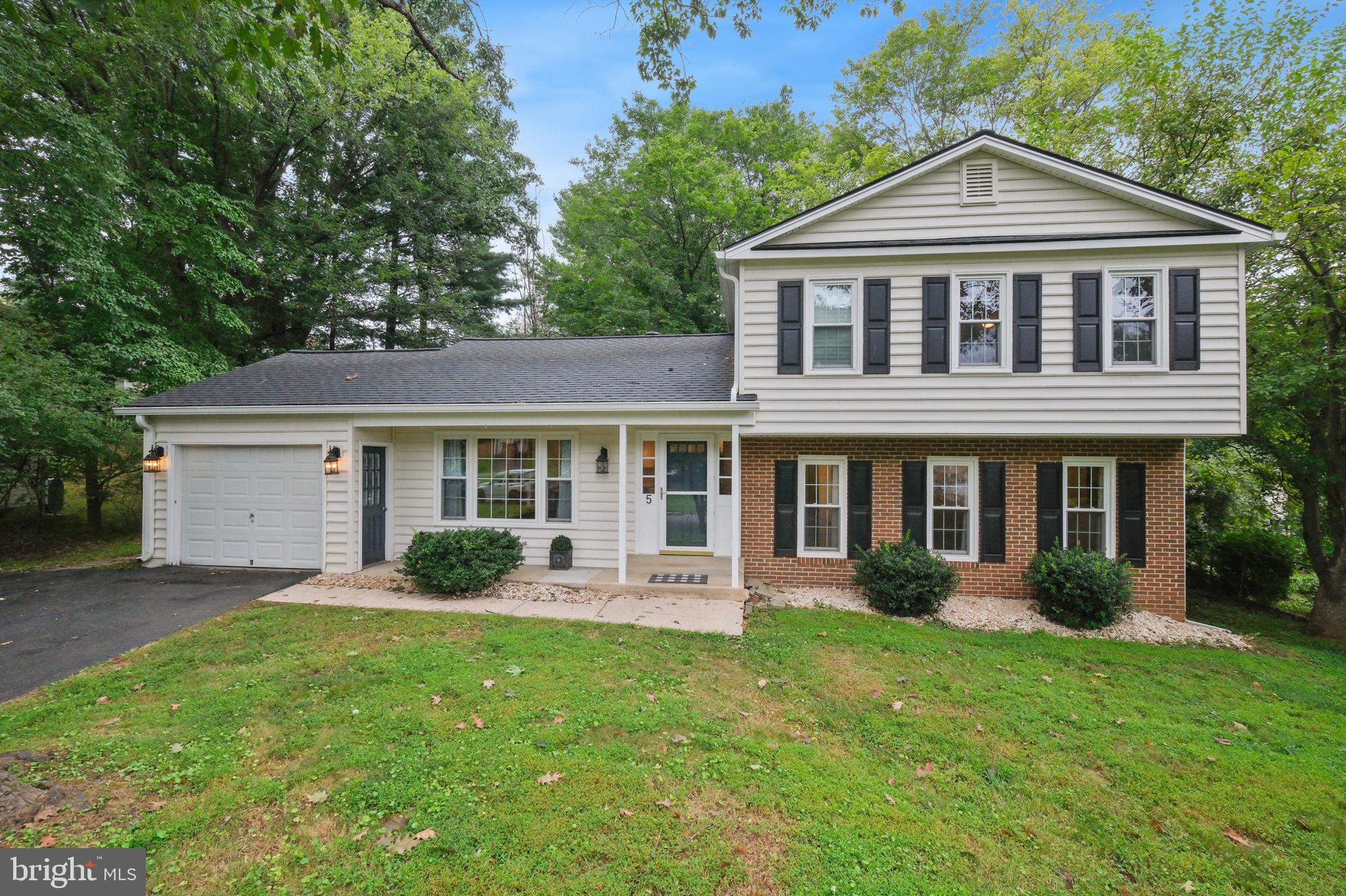 5 Winesap Court Gaithersburg, MD 20878 - Photo 3 of 44 a front view of a house with a yard and porch
