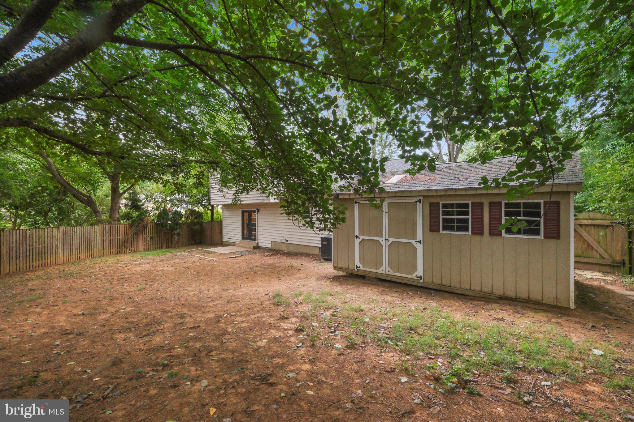 5 Winesap Court Gaithersburg, MD 20878 - Photo 34 of 44 a front view of house with yard and trees in the background