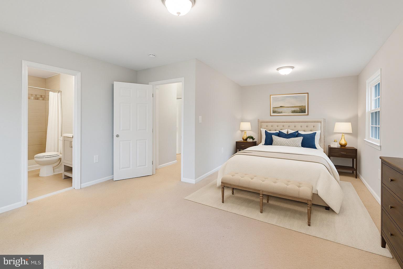 5 Winesap Court Gaithersburg, MD 20878 - Photo 10 of 44 a spacious bedroom with a bed and a lamp