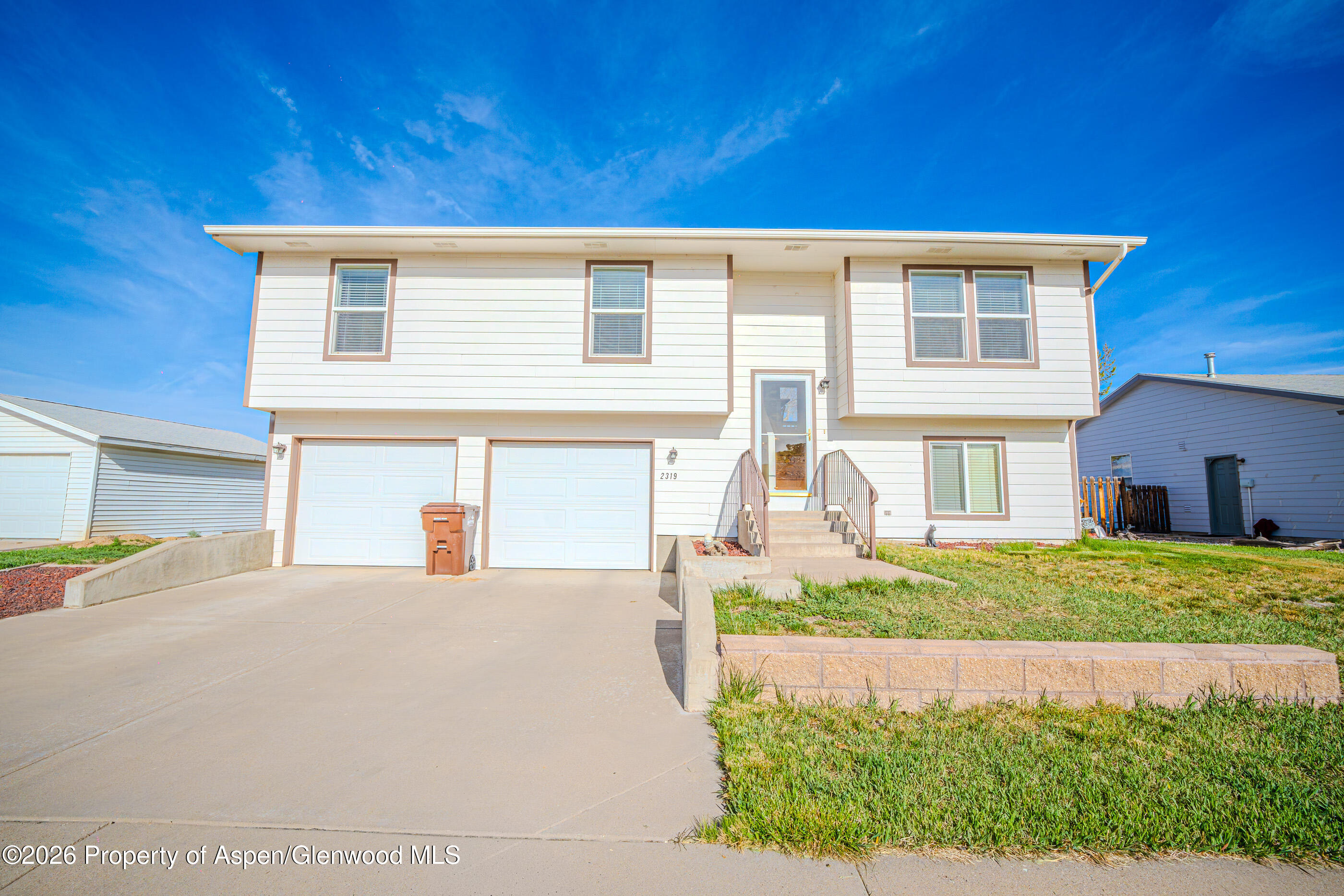 2319 Meadow Circle Rifle, CO 81650 - Photo 1 of 33 a front view of a house with a yard