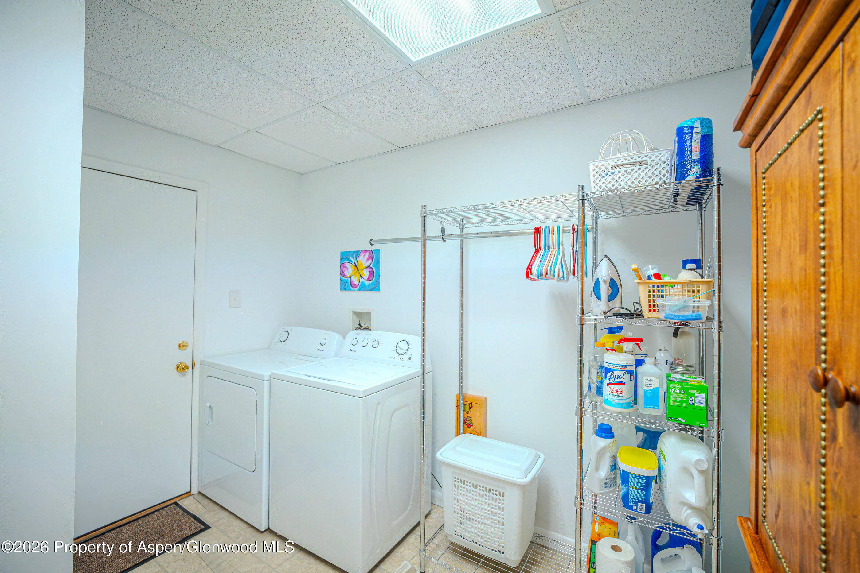 2319 Meadow Circle Rifle, CO 81650 - Photo 11 of 33 a utility room with fridge washer and dryer