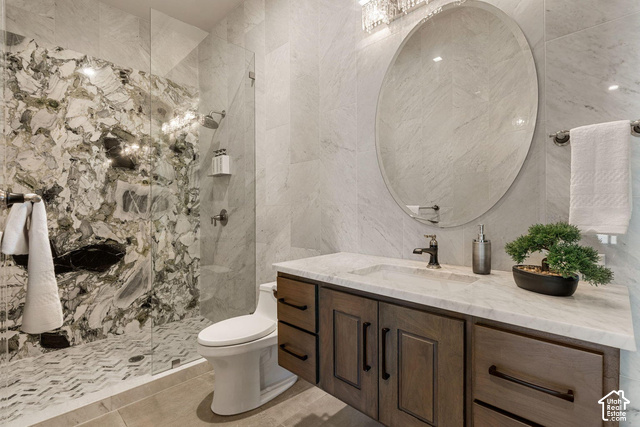 3652 South Cypress Road Hurricane, UT 84737 - Photo 16 of 81 Glass-enclosed shower with a striking natural stone wall and herringbone tile floor