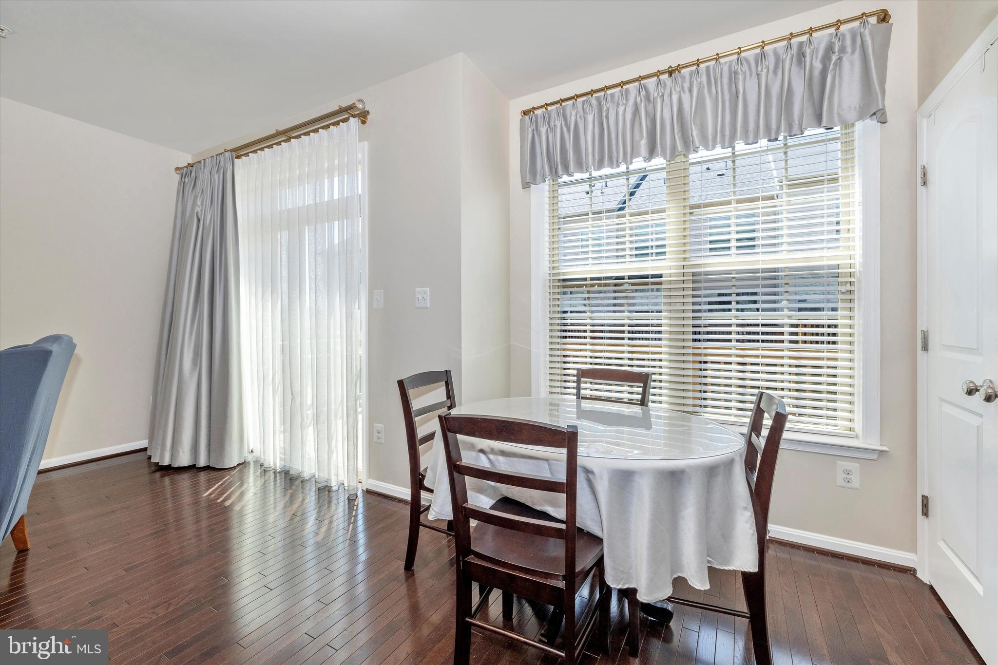 4731 Verdana Loop Frederick, MD 21703 - Photo 18 of 51 a view of a dining room with furniture and wooden floor