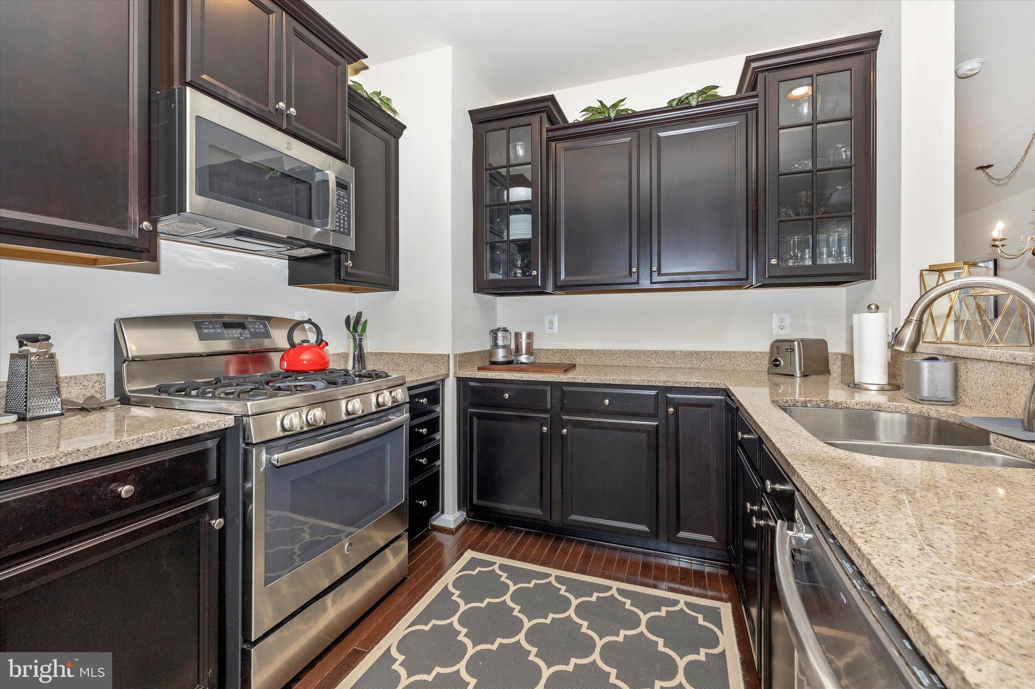 4731 Verdana Loop Frederick, MD 21703 - Photo 21 of 51 a kitchen with granite countertop stainless steel appliances and sink