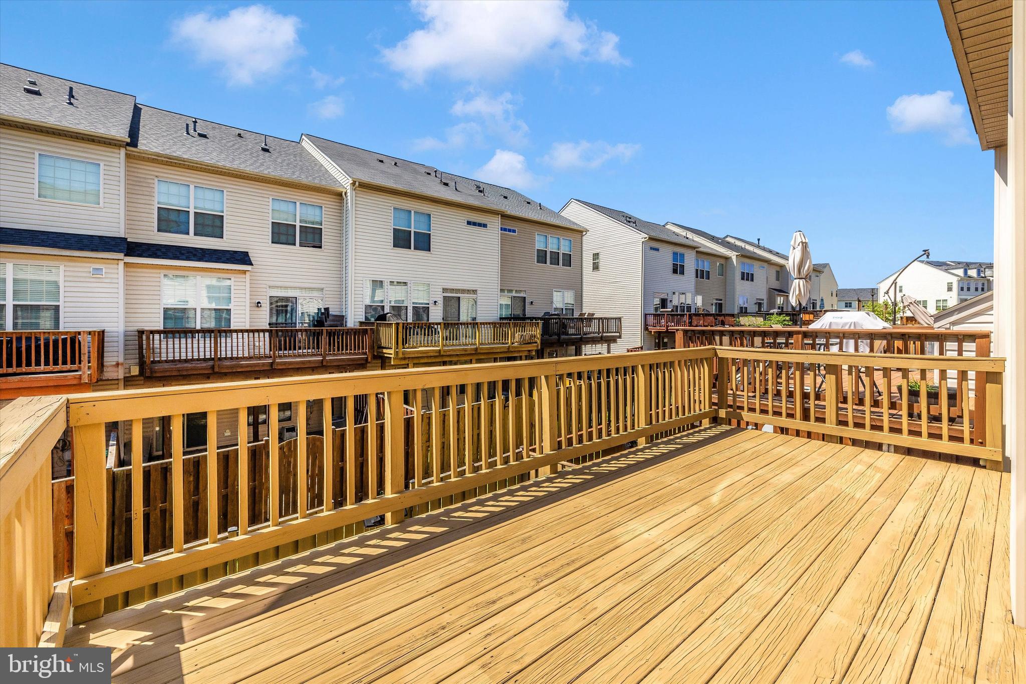4731 Verdana Loop Frederick, MD 21703 - Photo 24 of 51 a view of a wooden deck with large windows