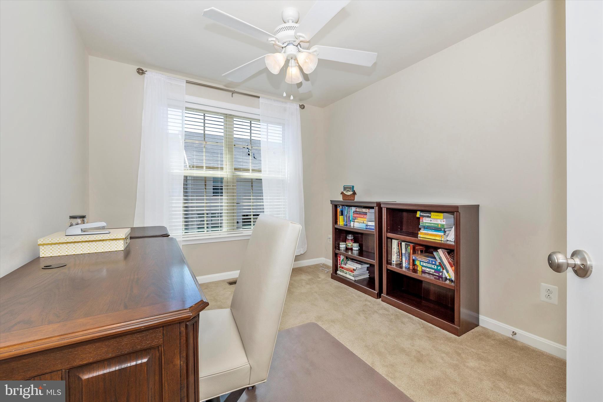 4731 Verdana Loop Frederick, MD 21703 - Photo 30 of 51 a living room with furniture and a flat screen tv