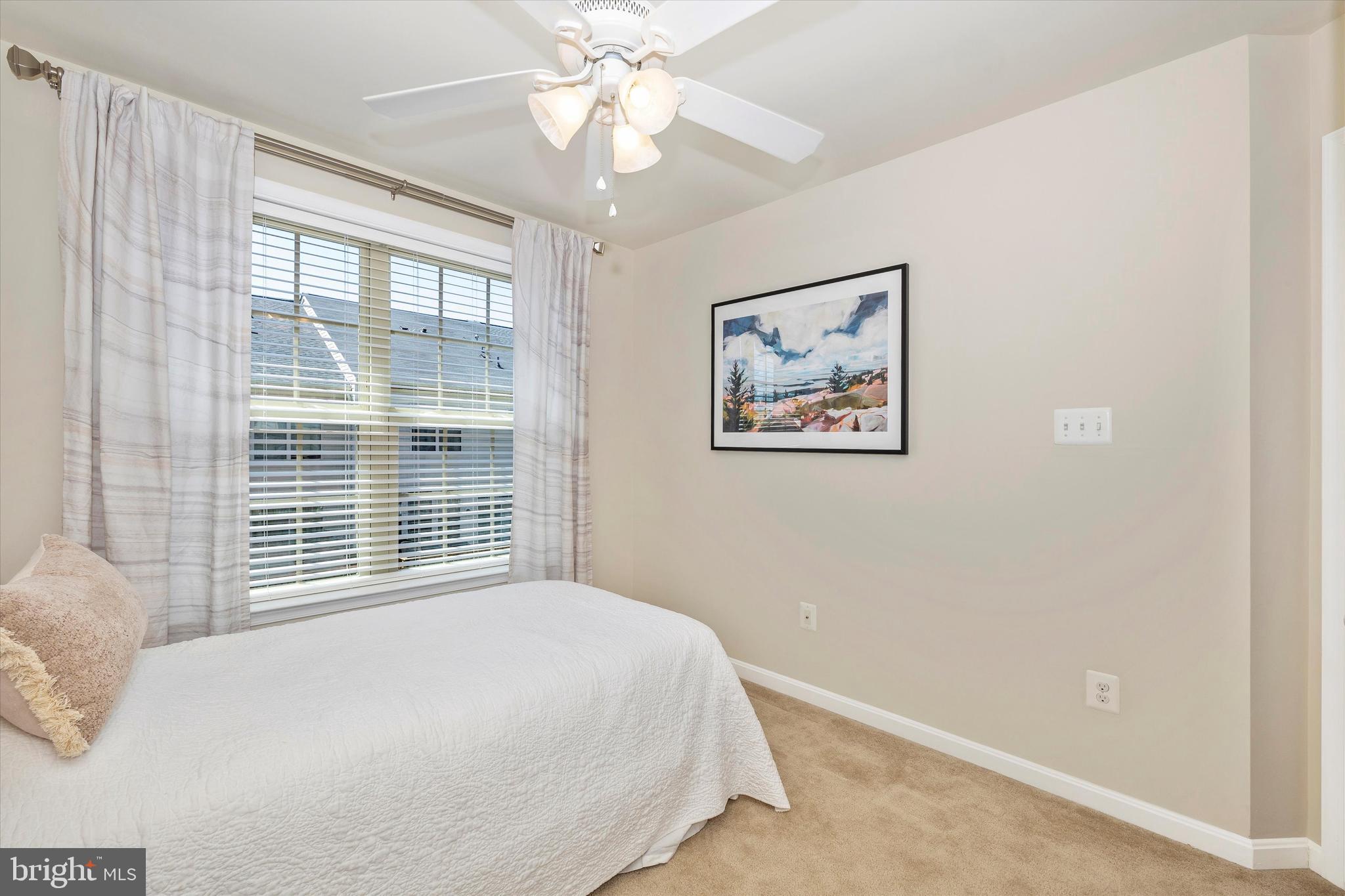 4731 Verdana Loop Frederick, MD 21703 - Photo 35 of 51 a bedroom with a large bed and a window