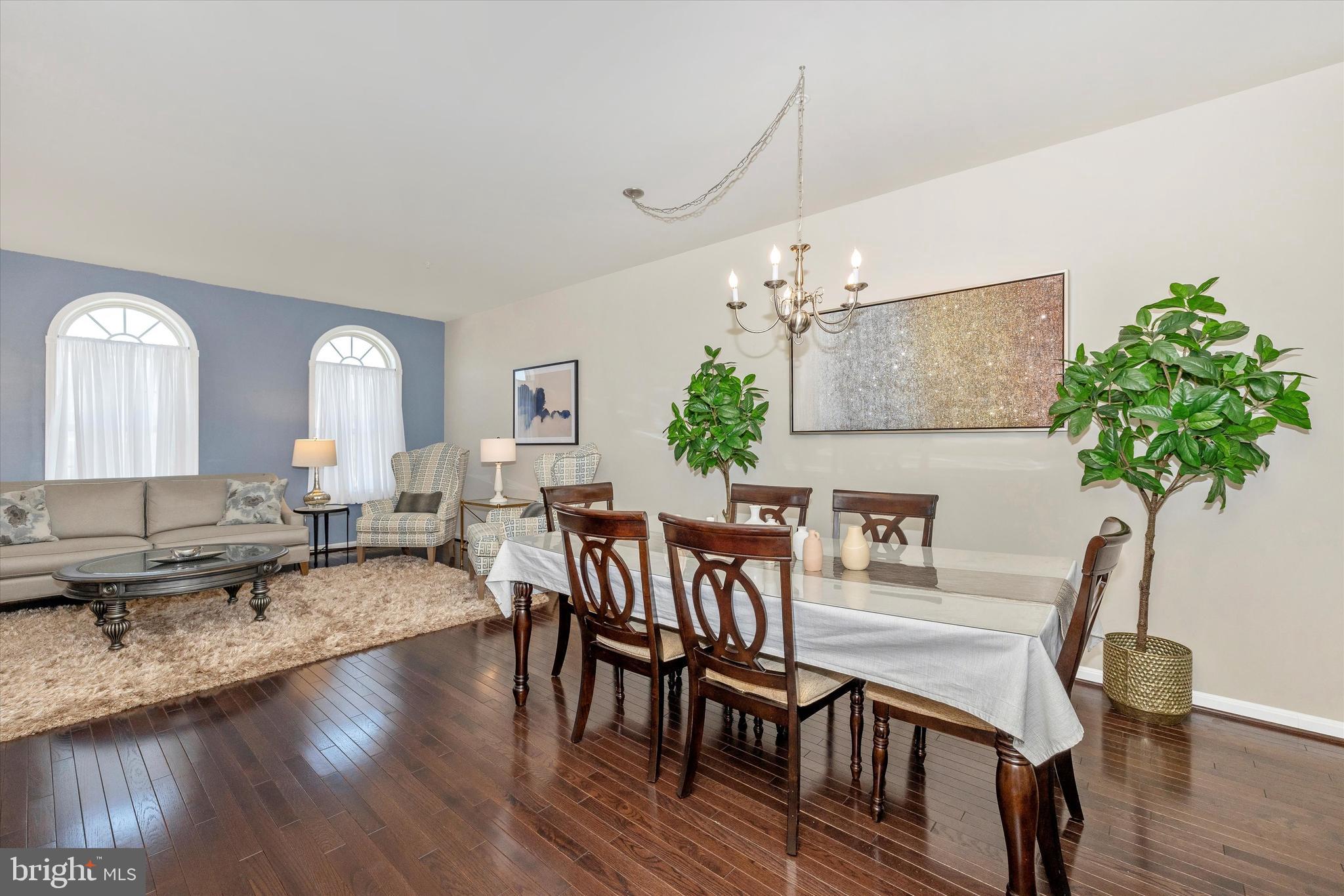 4731 Verdana Loop Frederick, MD 21703 - Photo 9 of 51 a view of a dining room with furniture window and wooden floor