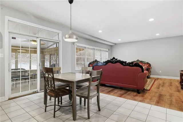 a view of a dining room with furniture and window