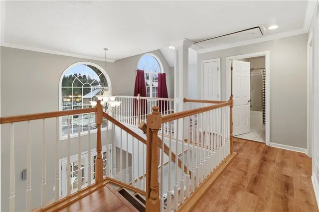 a view of entryway with wooden floor and windows