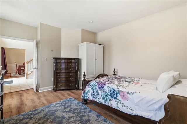 a bedroom with a bed and a dresser