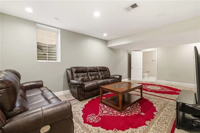 a living room with furniture and a rug